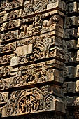 Orissa - Bhubaneswar. Parsurameswar Temple, 'rahapaga', the central projection of the southern face of the deul, in the medallion: Shiva begs food from Parvati. 