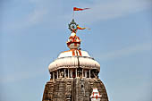 Orissa - Puri. Jagannatha Temple, the deul with the wheel (chakra) of Vishnu at the top and the long scarlet pennant that announces the presence of Lord Jagannath. 