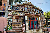 Orissa - Puri, colourful sculptures of Saptamatrikas and of the Dasamahavidya, the ten forms of the goddess,  on the facade of a temple found along the road leading to the beach. 