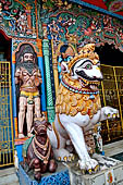 Orissa - Puri, colourful sculptures on the facade of a temple found along the road leading to the beach. 