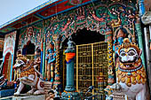 Orissa - Puri, colourful sculptures on the facade of a temple found along the road leading to the beach. 