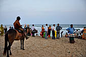 Orissa - Puri, the beach around sunset fills up with tourists and families. 