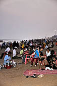 Orissa - Puri, the beach around sunset fills up with tourists and families. 