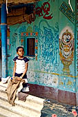 Orissa - Raghurajpur. Paintings decorating the house walls. 