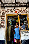 Orissa - Raghurajpur. Paintings decorating the house walls. 