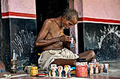 Orissa - Raghurajpur. Craftsman at work.