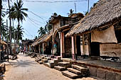 Orissa - Raghurajpur. Houses are lined at the sides of the village only road. 