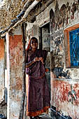 Orissa - Raghurajpur. Paintings decorating the house walls. 