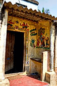 Orissa - Raghurajpur. Paintings decorating the house walls. 