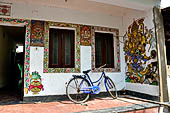 Orissa - Raghurajpur. Paintings decorating the house walls. 