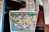 Orissa - Raghurajpur. 'Pattachitra' seller.