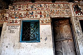 Orissa - Raghurajpur. Paintings decorating the house walls. 