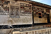 Orissa - Raghurajpur. Paintings decorating the house walls. 