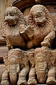 Orissa - Bhubaneswar. Rajarani temple, lions at the base of the pillars of the gates of the jagamohana.