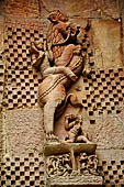 Orissa - Bhubaneswar. Rajarani temple, frieze of a 'virala' dragon represented rampant over an elephant with a knight raiding the monster.