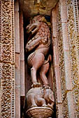 Orissa - Bhubaneswar. Rajarani temple, frieze of a 'virala' dragon represented rampant over an elephant.