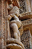 Orissa - Bhubaneswar. Rajarani temple, Kubera (dikpala of the north), God of Prosperity on top of seven jars of gems. 