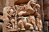 Orissa - Bhubaneswar. Rajarani temple, lions at the base of the pillars of the gates of the jagamohana.