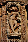 Orissa - Bhubaneswar. Rajarani temple, sculpture of 'alasa kanya' (indolent maiden) in languid and alluring poses.