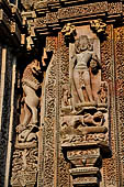 Orissa - Bhubaneswar. Rajarani temple, Nirriti (dikpala of south-west), god of suffering and misery on a prostrate figure and holding a severed head. 