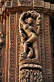 Orissa - Bhubaneswar. Rajarani temple, sculpture of 'alasa kanya' (indolent maiden) in languid and alluring poses. 