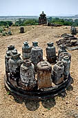 Ratnagiri - Portable monolithic stupas. A large number (more than 700) of small stupas are loose on the ground.