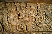 Udaigiri Cave 1  Rani Gumpha Queen's Cave - friezes of the upper storey. Kalinga queen carried away by Ashoka after the Kalinga battle. The fifth tableau: the bacchanalian scene, a huge person sitting on a chair attended by women, musicians and dancers. 