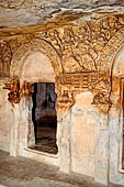 Udaigiri Cave 1  Rani Gumpha Queen's Cave - decorations of the three doorways of the veranda of the left wing of the ground floor. The first door (from left). 