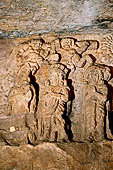 Udaigiri Cave 9 - the worshipping of the legendary Kalinga Jaina symbol. The figure wearing a crown (second from the left) is thought to be the Chedi king, Vakradeva, whose donative inscription can still be seen close by.  