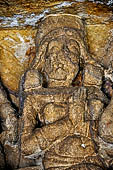 Udaigiri Cave 1 Rani Gumpha Queen's Cave - decorations the left wing of the lower storey represent the prince, princess, and courtiers as hermits, with their hands on their breasts.