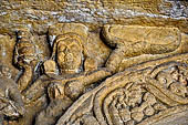 Udaigiri Cave 1 Rani Gumpha Queen's Cave - decorations of the three doorways of the veranda of the left wing of the ground floor. Detail of the first tableau (from left).