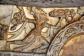 Udaigiri Cave 1 Rani Gumpha Queen's Cave - friezes of the upper storey. The story of a Kalinga queen carried away by Ashoka after the Kalinga battle. The first tableau represents a man running with a tray in one hand.