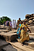 Orissa - Bhubaneswar. People visiting Udaigiri cave. 