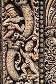 Udayagiri - Monastery n1 . Decoration detail of the richly carved doorframe of the sanctum. Climbing acrobats. 