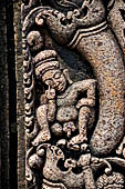 Udayagiri - Monastery n1. Decoration detail of the richly carved doorframe of the sanctum. Climbing acrobats. 