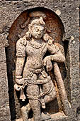 Udayagiri - Monastery n1. Decoration detail of the richly carved doorframe of the sanctum. Dvarapalas. 