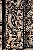 Udayagiri - Monastery n1. Decoration detail of the richly carved doorframe of the sanctum. Climbing acrobats. 