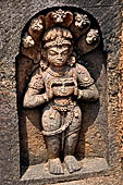 Udayagiri - Monastery n1. Decoration detail of the richly carved doorframe of the sanctum. Dvarapalas. 