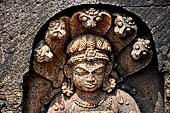 Udayagiri - Monastery n1. Decoration detail of the richly carved doorframe of the sanctum. Dvarapalas. 