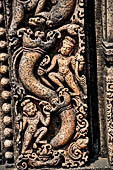 Udayagiri - Monastery n1. Decoration detail of the richly carved doorframe of the sanctum. Climbing acrobats. 