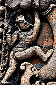 Udayagiri - Monastery n1. Decoration detail of the richly carved doorframe of the sanctum. Climbing acrobats. 