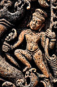 Udayagiri - Monastery n1. Decoration detail of the richly carved doorframe of the sanctum. Climbing acrobats. 