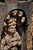 Udayagiri - Monastery n1. Decoration detail of the richly carved doorframe of the sanctum. Dvarapalas. 