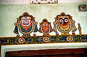 Orissa - village near Raghurajpur. Painting of  Lord Jagannath on the house wall. 