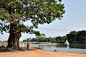 Orissa - The village of Hirapur. The tank with a small temple in the middle. 