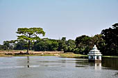 Orissa - The village of Hirapur. The tank with a small temple in the middle. 