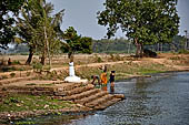 Orissa - The village of Hirapur. The tank with a small temple in the middle. 