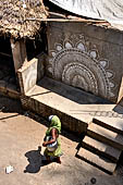 Orissa - village near Raghurajpur. House walls are painted with auspicious diagrams made with white rice paste. 