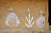 Orissa - traditional Brahmin villages near Puri. House walls are painted with auspicious diagrams made with white rice paste. 