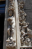 Catania Palazzo Biscari - details of the rich decoration of the windows of the facade.